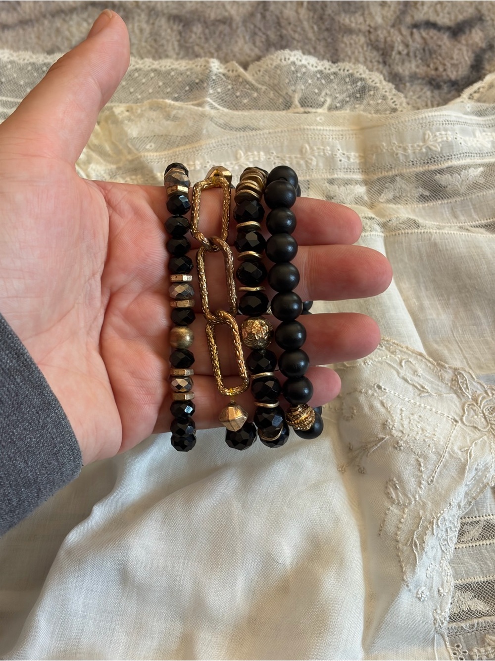 Boutique Black and gold beaded bracelets with gold accents #beaded #layered